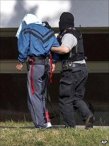 One of the suspected al-Qaeda members is brought to court in Karlsruhe, 30 April