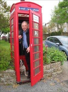 Parish Councillor Andrew Mate in the telephone box