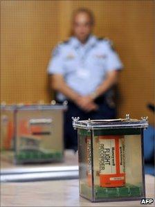 The flight recorders, preserved in a tank of demineralised water, are displayed in Le Bourget, Paris, 12 May