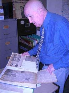 David St George looks through cuttings of the famous trial