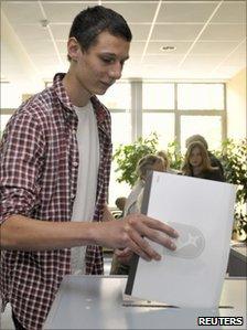 Johann Linnert, 16-year-old son of Green candidate Karoline Linnert, casts his ballot in state elections in Bremen, 22 May 2011