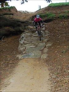 A rider heads down one of the woodland descents at the Olympic mountain bike course in Hadleigh