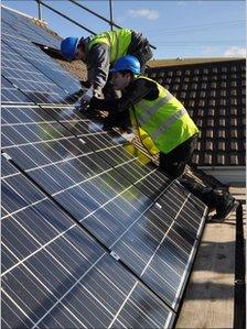 Dulas workers installing solar panels