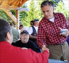 Jon Huntsman shakes hands at a cultural festival in New Hampshire