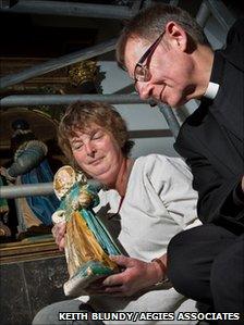 The Dean The Very Reverend Christopher Dalliston and restorer Deborah Carthy with one of the figures. Photo: Keith Blundy/Aegies Associates