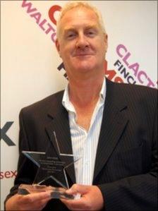 BBC Essex presenter Dave Monk with his award from the North Essex Partnership NHS Foundation Trust