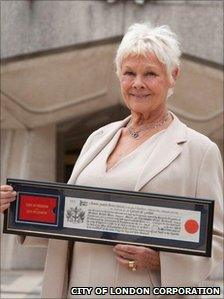 Dame Judi Dench collecting her award