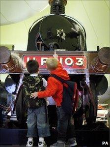 Two young visitors view an exhibit at the Riverside Museum in Glasgow