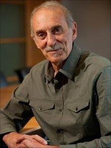 George Magnus in a green shirt