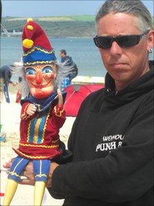 Mark Poulton and Mr Punch on the beach