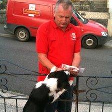 Wayne Davies with one of the dogs he meets on his rounds