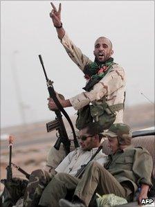 Libyan rebel fighters drive towards Brega front line, near Ajdabiya, (17 July 2011)