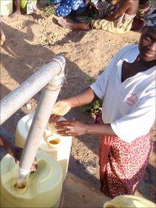 Woman getting water in Kenya