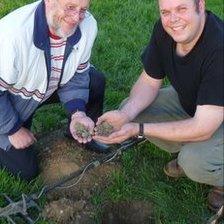 Adrian Simmons (r) and his father Reg with some of the coins