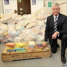 Brodie Clark, head of the border force for the UK Border Agency, with some of the drugs recovered