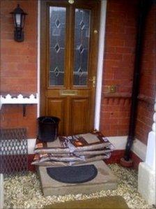 Front door covered by shop bought sandbags