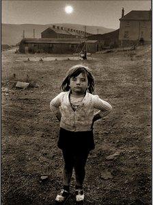 Little girl standing in a playground