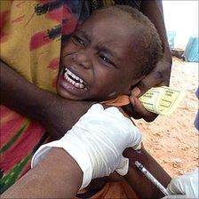 A Somali boy refugee is vaccinated against measles