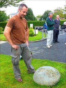 Roger Davis mulling over the 'feat stone' in Criccieth