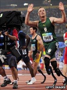 TV cameraman films Oscar Pistorius at Beijing Paralympics