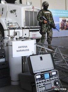 Troops stand next to confiscated communication equipment at a navy base in Veracruz on 8 September 2011.