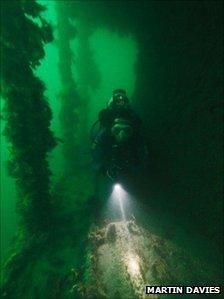 Diver moving through the companionway of the landing craft