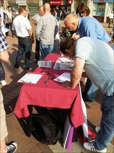 People signing a petition in Hull's Queen Victoria Square