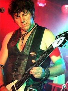 Neil Buchanan playing guitar