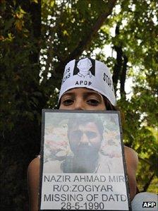 A member of the Association of Parents of Disappeared People (APDP) attend a protest rally to demand information of the whereabouts of missing relatives in Srinagar.