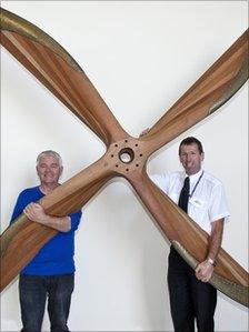 Mike McKenzie and Dave Steele, from from aviation company Multiflight, display the historic propeller