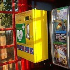 Telephone box with defibrillator