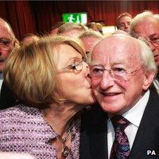 Labour candidate Michael D Higgins receives a kiss from his wife Sabina Coyne