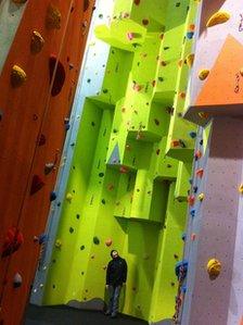 Lesley Gwyer shows the scale of the new climbing wall