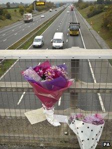 Floral tributes left on a bridge over the M5 near the crash scene