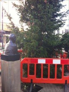 The statue of Trevor Huddleston and the Christmas tree