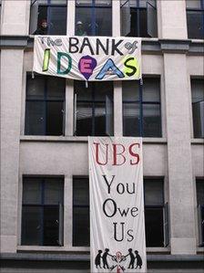 Occupy London banners outside empty UBS office