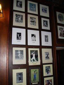 Photos on the wall of a cricket club in Sri Lanka