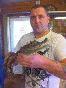 South American crocodile with shop owner Jimmy Wicks