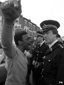 PA file photo dated 10/07/1981 of a youth confronting a senior police officer during the Brixton riots.