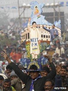 A supporter holds a cutout of the map of India with images of Mayawati, the chief minister of the northern Indian state of Uttar Pradesh