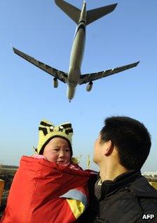 People and plane at Chinese airport