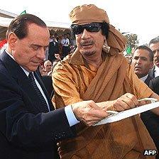 Silvio Berlusconi and Muammar Gaddafi