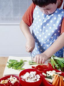 A boy cooking a stir fry