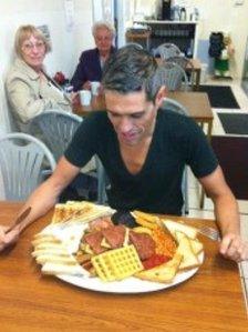 Robert Pinto about to eat the Hungry Hossee big breakfast. Photo: Robert Pinto