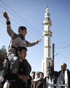 Syrian anti-regime protesters shout slogans during a demonstration in Al-Qsair, 25kms southwest of the flashpoint city Homs, Syria.