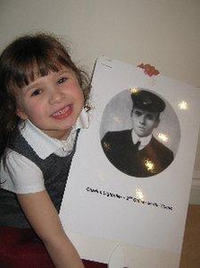 Schoolgirl holding placard of Charles Lightoller