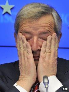 Luxembourg Prime Minister and Eurogroup president Jean-Claude Juncker rubs his eyes at a news conference in Brussels, 21 February