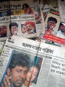 Newspapers carrying Qutubuddin Ansari's pictures