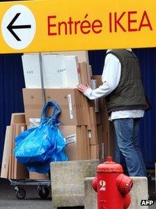 Man leaves Ikea obscured by sign