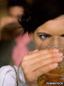 Woman drinking lager